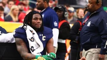 Jan 1, 2016; Glendale, AZ, USA; Notre Dame Fighting Irish linebacker Jaylon Smith (9) cries as he is carted off the field after suffering an injury un the first quarter against the Ohio State Buckeyes during the 2016 Fiesta Bowl at University of Phoenix Stadium. Mandatory Credit: Mark J. Rebilas-USA TODAY Sports