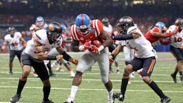 Jan 1, 2016; New Orleans, LA, USA; Mississippi Rebels wide receiver Laquon Treadwell (1) scores on a ten-yard catch past the defense by Oklahoma State Cowboys safety Jordan Sterns (13) and cornerback Kevin Peterson (1) in the second quarter of the 2016 Sugar Bowl at the Mercedes-Benz Superdome. Mandatory Credit: Chuck Cook-USA TODAY Sports