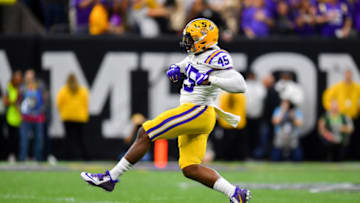 NEW ORLEANS, LOUISIANA - JANUARY 13: Michael Divinity Jr. #45 of the LSU Tigers struts after a big defensive play during the first quarter of the College Football Playoff National Championship game against the Clemson Tigers at the Mercedes Benz Superdome on January 13, 2020 in New Orleans, Louisiana. The LSU Tigers topped the Clemson Tigers, 42-25. (Photo by Alika Jenner/Getty Images)