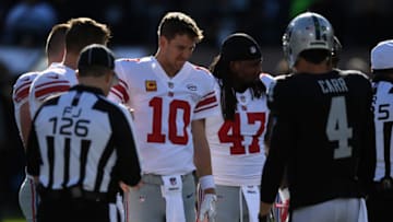 OAKLAND, CA - DECEMBER 03: Eli Manning #10 of the New York Giants watches the coin toss during their NFL game against the Oakland Raiders at Oakland-Alameda County Coliseum on December 3, 2017 in Oakland, California. (Photo by Thearon W. Henderson/Getty Images)