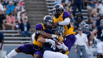 HOUSTON, TX - AUGUST 25: Quinton Bell #8 of the Prairie View Am Panthers tackles Austin Trammell #10 of the Rice Owls in the first half at Rice Stadium on August 25, 2018 in Houston, Texas. (Photo by Tim Warner/Getty Images)