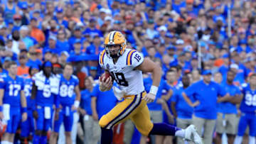 GAINESVILLE, FL - OCTOBER 06: Foster Moreau #18 of the LSU Tigers rushes for yardage during the game against the Florida Gators at Ben Hill Griffin Stadium on October 6, 2018 in Gainesville, Florida. (Photo by Sam Greenwood/Getty Images)