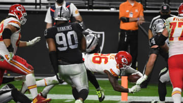 LAS VEGAS, NEVADA - NOVEMBER 22: Running back Le'Veon Bell #26 of the Kansas City Chiefs dives into the end zone for a touchdown past the defense of defensive tackle Johnathan Hankins #90 of the Las Vegas Raiders during the second half of an NFL game at Allegiant Stadium on November 22, 2020 in Las Vegas, Nevada. (Photo by Ethan Miller/Getty Images)