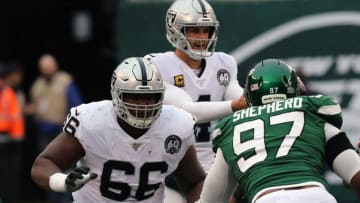 EAST RUTHERFORD, NEW JERSEY - NOVEMBER 24: Guard Gabe Jackson #66 of the Oakland Raiders blocks against the New York Jets in the first half in the rain at MetLife Stadium on November 24, 2019 in East Rutherford, New Jersey. (Photo by Al Pereira/Getty Images).