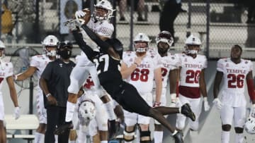 ORLANDO, FL - NOVEMBER 14: Richie Grant #27 of the Central Florida Knights attempts to break up a pass to Jadan Blue #5 of the Temple Owls at Bounce House-FBC Mortgage Field on November 14, 2020 in Orlando, Florida. (Photo by Alex Menendez/Getty Images)