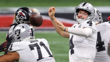 ATLANTA, GEORGIA - NOVEMBER 29: Derek Carr #4 of the Las Vegas Raiders is stripped of the ball during their NFL game against the Atlanta Falcons at Mercedes-Benz Stadium on November 29, 2020 in Atlanta, Georgia. (Photo by Kevin C. Cox/Getty Images)
