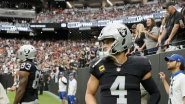 LAS VEGAS, NEVADA - OCTOBER 10: Tight end Darren Waller #83 and quarterback Derek Carr #4 of the Las Vegas Raiders wait to be introduced before a game against the Chicago Bears at Allegiant Stadium on October 10, 2021 in Las Vegas, Nevada. The Bears defeated the Raiders 20-9. (Photo by Ethan Miller/Getty Images)