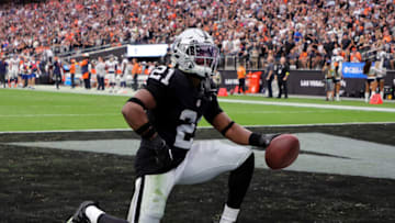 LAS VEGAS, NEVADA - OCTOBER 02: Amik Robertson #21 of the Las Vegas Raiders celebrates after recovering a 68-yard fumble and scoring a touchdown in the second quarter against the Denver Broncos at Allegiant Stadium on October 02, 2022 in Las Vegas, Nevada. (Photo by Ethan Miller/Getty Images)