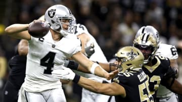 NEW ORLEANS, LOUISIANA - OCTOBER 30: Derek Carr #4 of the Las Vegas Raiders is preasured by Kaden Elliss #55 of the New Orleans Saints during an NFL game at Caesars Superdome on October 30, 2022 in New Orleans, Louisiana. (Photo by Sean Gardner/Getty Images)