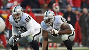KANSAS CITY, MO - JANUARY 03: Center Rodney Hudson #61 and offensive guard Jon Feliciano #68 of the Oakland Raiders get set on the line against the Kansas City Chiefs during the first half on January 3, 2016 at Arrowhead Stadium in Kansas City, Missouri. (Photo by Peter G. Aiken/Getty Images)