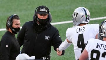 Las Vegas Raiders head coach Jon Gruden shakes quarterback Derek Carr's (4) hand after a touchdown in the first half against the New York Jets at MetLife Stadium on Sunday, Dec. 6, 2020, in East Rutherford.
Nyj Vs Lv