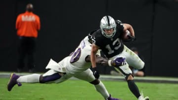 Sep 13, 2021; Paradise, Nevada, USA; Las Vegas Raiders wide receiver Hunter Renfrow (13) runs the ball against Baltimore Ravens linebacker Justin Houston (50) during the second half at Allegiant Stadium. Mandatory Credit: Kirby Lee-USA TODAY Sports