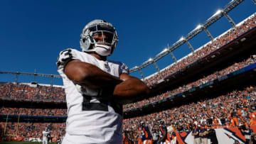 Oct 17, 2021; Denver, Colorado, USA; Las Vegas Raiders running back Kenyan Drake (23) celebrates after his touchdown in the second quarter against the Denver Broncos at Empower Field at Mile High. Mandatory Credit: Isaiah J. Downing-USA TODAY Sports