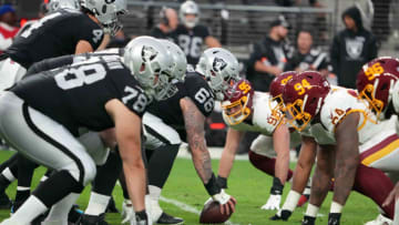 Dec 5, 2021; Paradise, Nevada, USA; A general overall view of the line of scrimmage as Las Vegas Raiders center Nick Martin (66) snaps the ball against the Washington Football Team in the second half at Allegiant Stadium. Mandatory Credit: Kirby Lee-USA TODAY Sports