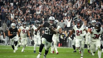 Oct 23, 2022; Paradise, Nevada, USA; Las Vegas Raiders running back Josh Jacobs (28) scores on a 15-yard touchdown run in the fourth quarter against the Houston Texans at Allegiant Stadium. Mandatory Credit: Kirby Lee-USA TODAY Sports