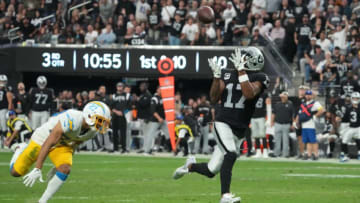 Dec 4, 2022; Paradise, Nevada, USA; Las Vegas Raiders wide receiver Davante Adams (17) scores on a 45-yard touchdown reception against Los Angeles Chargers cornerback Bryce Callahan (23) in the second half at Allegiant Stadium. The Raiders defeated the Chargers 27-20. Mandatory Credit: Kirby Lee-USA TODAY Sports