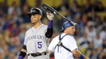 June 8, 2016; Los Angeles, CA, USA; Colorado Rockies right fielder Carlos Gonzalez (5) throws his bat after striking out in the sixth inning against Los Angeles Dodgers at Dodger Stadium. Mandatory Credit: Gary A. Vasquez-USA TODAY Sports