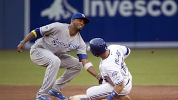 Jul 5, 2016; Toronto, Ontario, CAN; Toronto Blue Jays center fielder Kevin Pillar (11) is tagged out at second base by Kansas City Royals shortstop Alcides Escobar (2) during the third inning in a game at Rogers Centre. Mandatory Credit: Nick Turchiaro-USA TODAY Sports