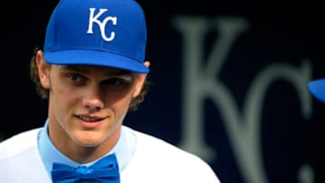 KANSAS CITY, MO - JUNE 17: After signing with the Kansas City Royals, number one draft pick Ashe Russell watches the Royals take batting practice prior to a game Milwaukee Brewers at Kauffman Stadium on June 17, 2015 in Kansas City, Missouri. (Photo by Ed Zurga/Getty Images)
