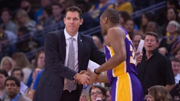 November 24, 2015; Oakland, CA, USA; Golden State Warriors interim head coach Luke Walton (left) shakes hands with Los Angeles Lakers forward Metta World Peace (37, right) during the fourth quarter at Oracle Arena. The Warriors defeated the Lakers 111-77. Mandatory Credit: Kyle Terada-USA TODAY Sports