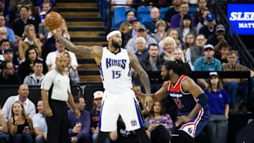 Mar 30, 2016; Sacramento, CA, USA; Sacramento Kings center DeMarcus Cousins (15) controls the ball against Washington Wizards center Nene Hilario (42) during the second quarter at Sleep Train Arena. Mandatory Credit: Kelley L Cox-USA TODAY Sports