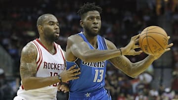 Oct 7, 2015; Houston, TX, USA; Dallas Mavericks forward Jamil Wilson (13) passes the ball against Houston Rockets guard Marcus Thornton (10) in the third quarter at Toyota Center. Mandatory Credit: Thomas B. Shea-USA TODAY Sports