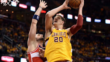 Mar 4, 2016; Cleveland, OH, USA; Cleveland Cavaliers center Timofey Mozgov (20) drives against Washington Wizards center Marcin Gortat (13) during the third quarter at Quicken Loans Arena. The Cavs won 108-83. Mandatory Credit: Ken Blaze-USA TODAY Sports