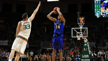 Jan 25, 2016; Coral Gables, FL, USA; Duke Blue Devils guard Brandon Ingram (14) shoots over Miami Hurricanes forward Ivan Cruz Uceda (33) during the first half at BankUnited Center. Mandatory Credit: Steve Mitchell-USA TODAY Sports