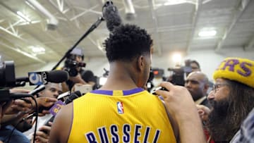 Mar 23, 2016; Phoenix, AZ, USA; Los Angeles Lakers forward Larry Nance Jr. (7) and guard D'Angelo Russell (1) against the Phoenix Suns at Talking Stick Resort Arena. The Suns defeated the Lakers 119-107. Mandatory Credit: Mark J. Rebilas-USA TODAY Sports