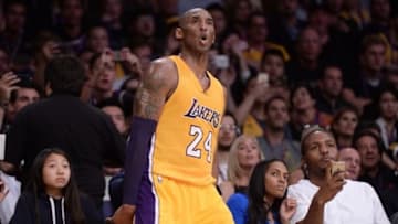 Apr 13, 2016; Los Angeles, CA, USA; Los Angeles Lakers forward Kobe Bryant (24) reacts as sideline fans watch his jump shot during the third quarter against the Utah Jazz at Staples Center. Bryant was playing in the final game of his NBA career. Bryant was playing in the final game of his NBA career. Mandatory Credit: Robert Hanashiro-USA TODAY Sports