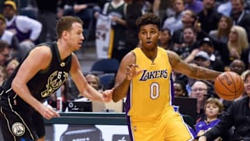 Feb 22, 2016; Milwaukee, WI, USA; Milwaukee Bucks forward Steve Novak (6) guards Los Angeles Lakers forward Nick Young (0) in the fourth quarter at BMO Harris Bradley Center. The Bucks beat the Lakers 108-101. Mandatory Credit: Benny Sieu-USA TODAY Sports