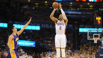 Mar 24, 2015; Oklahoma City, OK, USA; Oklahoma City Thunder guard Russell Westbrook (0) shoots a 3 point shot against Los Angeles Lakers guard Jeremy Lin (17) during the third quarter at Chesapeake Energy Arena. Mandatory Credit: Mark D. Smith-USA TODAY Sports