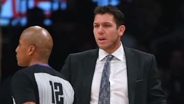 LOS ANGELES, CA - DECEMBER 27: Head coach Luke Walton of the Los Angeles Lakers discusses a foul call with referee CJ Washington
