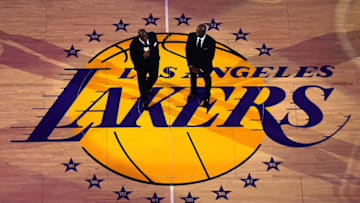 LOS ANGELES, CA - DECEMBER 18: Ervin 'Magic' Johnson speaks to Kobe Bryant at Bryant's jersey retirement ceremony during halftime of a basketball game between the Los Angeles Lakers and the Golden State Warriors at Staples Center on December 18, 2017 in Los Angeles, California. (Photo by Harry How/Getty Images)
