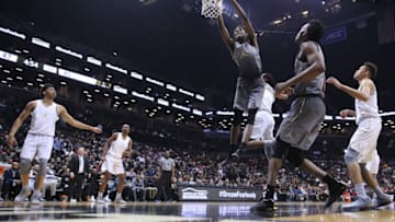 NEW YORK, NEW YORK - April 14: Mitchell Robinson #24 W. Kentucky dunks while defended by Billy Preston #0 Kansas during the Jordan Brand Classic, National Boys Team All-Star basketball game at The Barclays Center on April 14, 2017 in New York City. (Photo by Tim Clayton/Corbis via Getty Images)