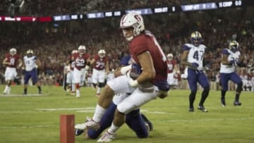 Stanford Cardinal tight end Austin Hooper (18, front) scores a touchdown against Washington Huskies defensive back Ezekiel Turner (24, back). Kyle Terada-USA TODAY Sports