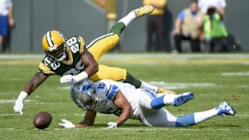 Sep 25, 2016; Green Bay, WI, USA; Detroit Lions wide receiver Golden Tate (15) cannot catch a pass while defended by Green Bay Packers cornerback Josh Hawkins (28) in the second quarter at Lambeau Field. Benny Sieu-USA TODAY Sports