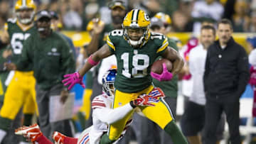 Oct 9, 2016; Green Bay, WI, USA; Green Bay Packers wide receiver Randall Cobb (18) is tackled by New York Giants cornerback Leon Hall (25) after catching a pass during the first quarter at Lambeau Field. Mandatory Credit: Jeff Hanisch-USA TODAY Sports