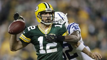 Nov 6, 2016; Green Bay, WI, USA; Green Bay Packers quarterback Aaron Rodgers loses the ball as he is hit by Indianapolis Colts defender T.J. Green in the fourth quarter at Lambeau Field. Mandatory Credit: Dan Powers/The Post-Crescent via USA TODAY Sports