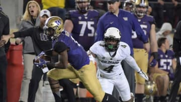 Washington Huskies wide receiver John Ross (1) runs for a touchdown after a catch defended by Colorado Buffaloes defensive back Chidobe Awuzie (4) in the third quarter during the Pac-12 championship at Levi