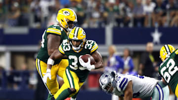 ARLINGTON, TEXAS - OCTOBER 06: Aaron Jones #33 of the Green Bay Packers runs the ball against the Dallas Cowboys in the third quarter at AT&T Stadium on October 06, 2019 in Arlington, Texas. (Photo by Ronald Martinez/Getty Images)