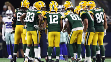 ARLINGTON, TEXAS - OCTOBER 06: Aaron Rodgers #12 of the Green Bay Packers huddles the offense against the Dallas Cowboys at AT&T Stadium on October 06, 2019 in Arlington, Texas. (Photo by Ronald Martinez/Getty Images)