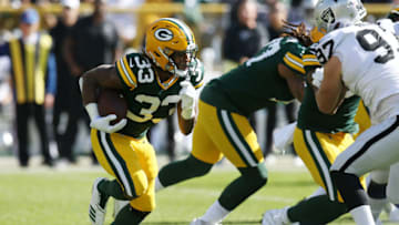 GREEN BAY, WISCONSIN - OCTOBER 20: Aaron Jones #33 of the Green Bay Packers runs with the ball during the first half against the Oakland Raiders in the game at Lambeau Field on October 20, 2019 in Green Bay, Wisconsin. (Photo by Dylan Buell/Getty Images)