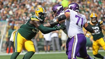 GREEN BAY, WI - SEPTEMBER 16: Muhammad Wilkerson #96 of the Green Bay Packers rushes against Tom Compton #79 and Riley Reiff #71 of the Minnesota Vikings at Lambeau Field on September 16, 2018 in Green Bay, Wisconsin. The Vikings and the Packers tied 29-29 after overtime. (Photo by Jonathan Daniel/Getty Images)