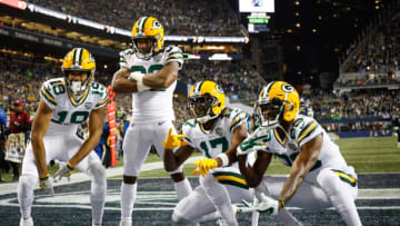 SEATTLE, WA - NOVEMBER 15: Aaron Jones #33 of the Green Bay Packers celebrate a touchdown during the first quarter against the Seattle Seahawks at CenturyLink Field on November 15, 2018 in Seattle, Washington. (Photo by Otto Greule Jr/Getty Images)
