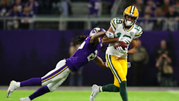 MINNEAPOLIS, MN - NOVEMBER 25: Equanimeous St. Brown #19 of the Green Bay Packers catches the ball as he is hit by Trae Waynes #26 of the Minnesota Vikings in the second quarter of the game at U.S. Bank Stadium on November 25, 2018 in Minneapolis, Minnesota. (Photo by Adam Bettcher/Getty Images)