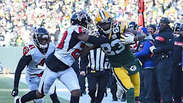 GREEN BAY, WISCONSIN - DECEMBER 09: Marquez Valdes-Scantling #83 of the Green Bay Packers gets pushed out of bounds by Robert Alford #23 of the Atlanta Falcons during the first half of a game at Lambeau Field on December 09, 2018 in Green Bay, Wisconsin. (Photo by Stacy Revere/Getty Images)