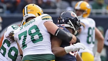 CHICAGO, IL - DECEMBER 16: Khalil Mack #52 of the Chicago Bears completes a backward sack of Aaron Rodgers #12 of the Green Bay Packers while being blocked by Jason Spriggs #78 at Soldier Field on December 16, 2018 in Chicago, Illinois. (Photo by Jonathan Daniel/Getty Images)