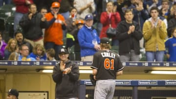 Apr 29, 2016; Milwaukee, WI, USA; Miami Marlins pitcher Adam Conley (61) walks to the dugout after being pulled from the game during the eighth inning against the Milwaukee Brewers at Miller Park. Mandatory Credit: Jeff Hanisch-USA TODAY Sports