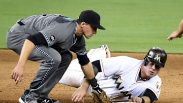 May 3, 2016; Miami, FL, USA; Arizona Diamondbacks shortstop Nick Ahmed (13) tags out Miami Marlins first baseman Justin Bour (41) at second base during the eighth inning at Marlins Park.The Marlins won 7-4. Mandatory Credit: Steve Mitchell-USA TODAY Sports